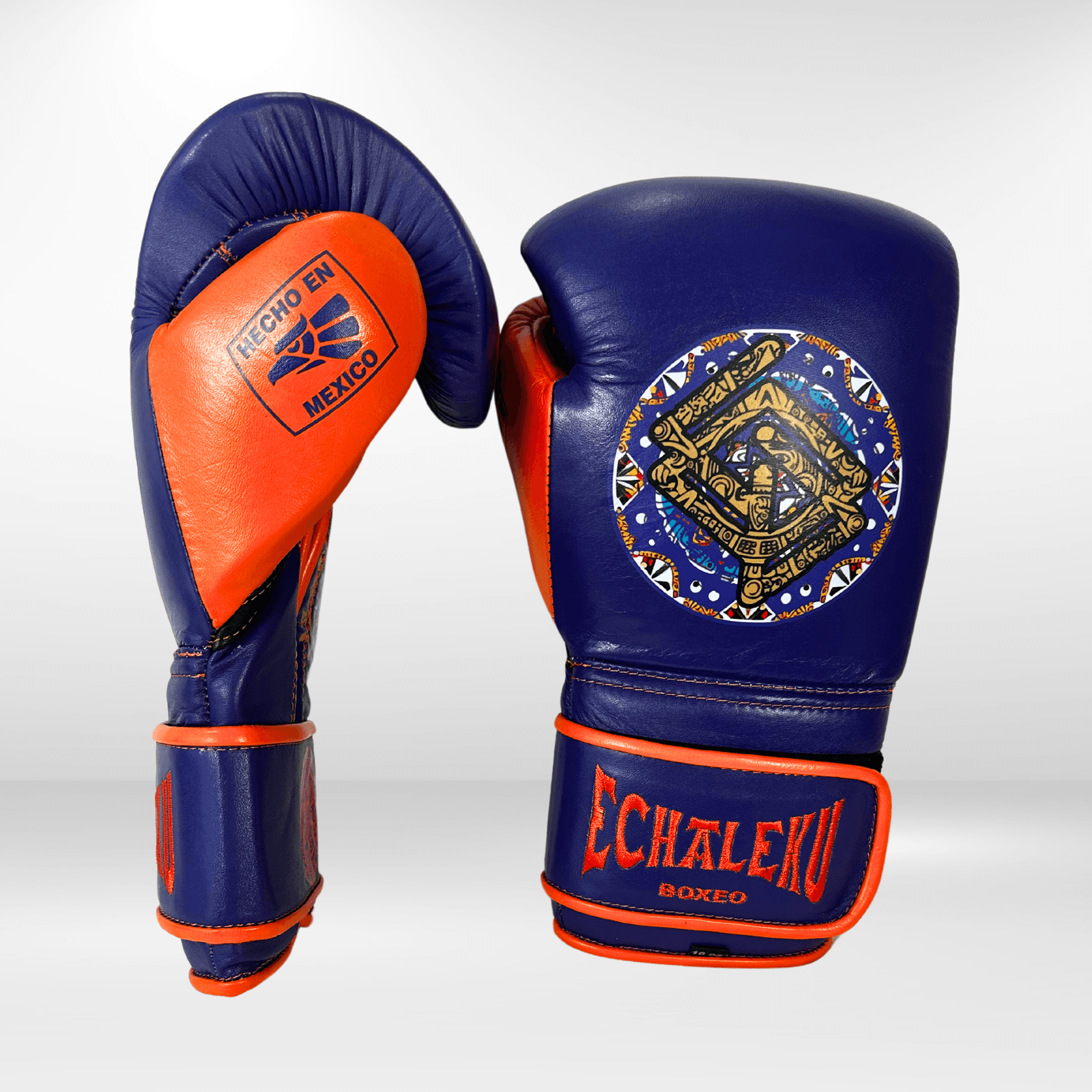 GUANTES PREMIUM ENTRENAMIENTO BOXEO PROFESIONAL: COLECCIÓN AZTECA fabricada en México. Vida y Muerte. Color Morado y Naranja. - Echaleku Boxeo