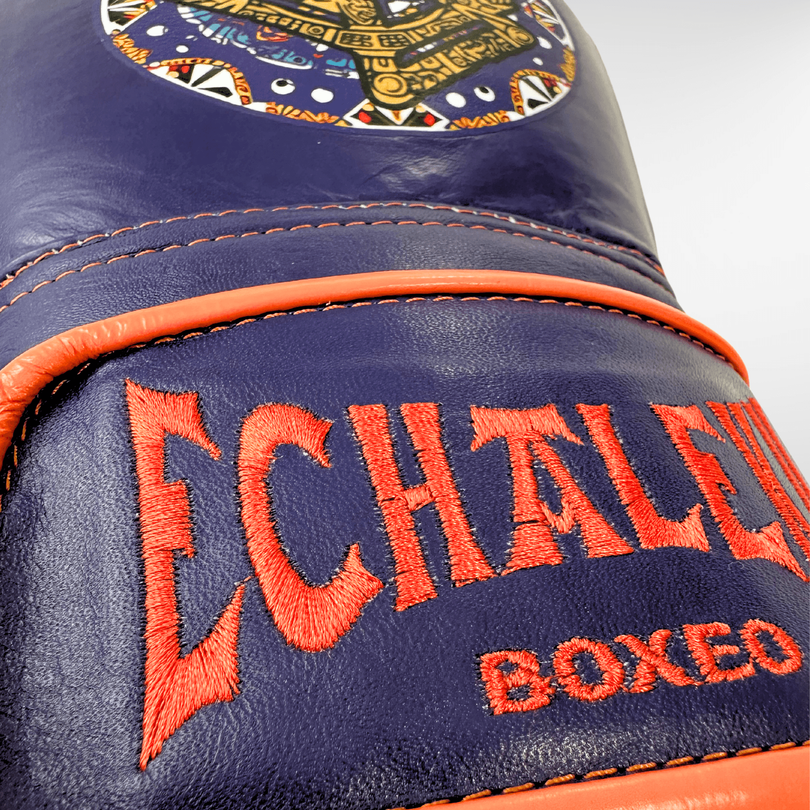 GUANTES PREMIUM ENTRENAMIENTO BOXEO PROFESIONAL: COLECCIÓN AZTECA fabricada en México. Vida y Muerte. Color Morado y Naranja. - Echaleku Boxeo