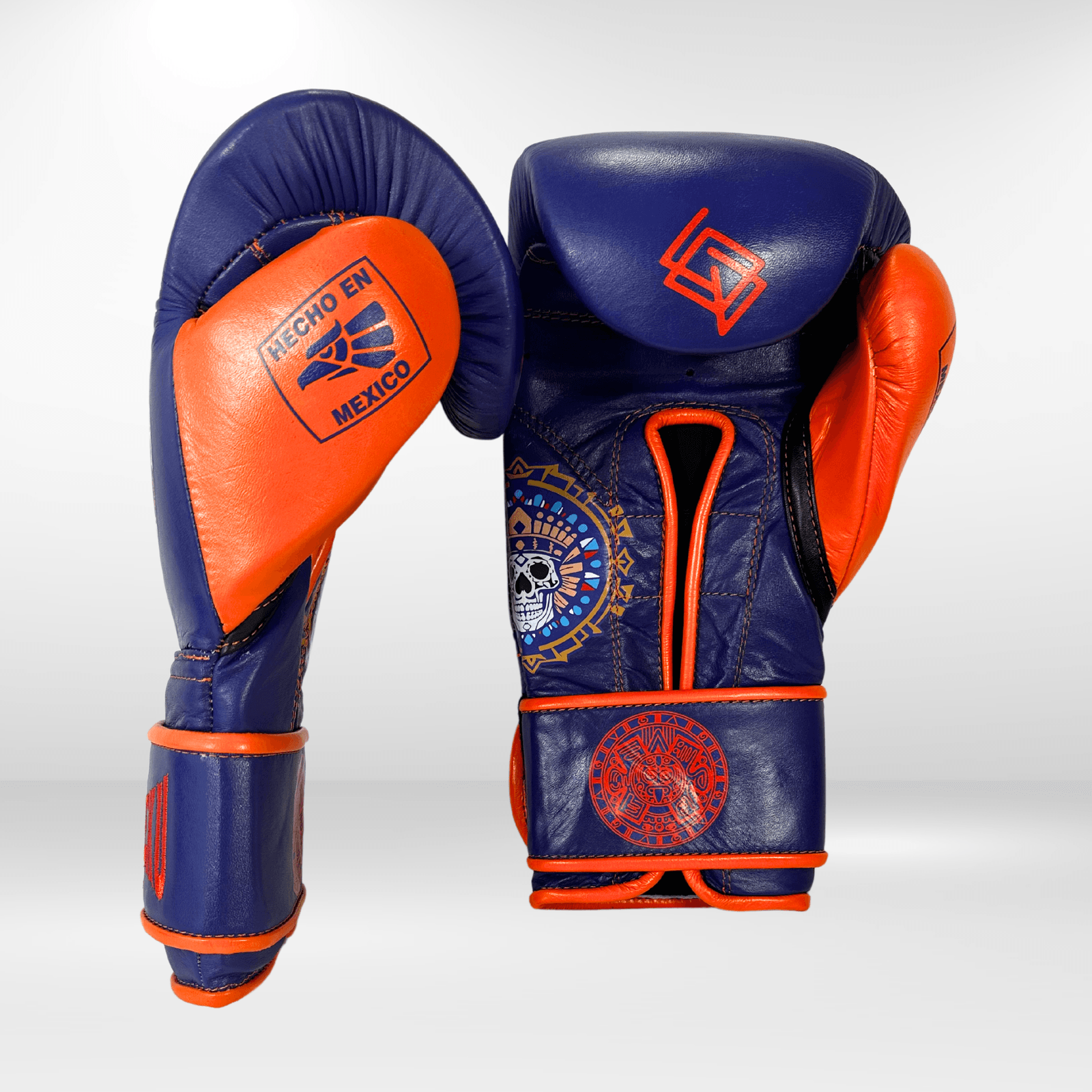 GUANTES PREMIUM ENTRENAMIENTO BOXEO PROFESIONAL: COLECCIÓN AZTECA fabricada en México. Vida y Muerte. Color Morado y Naranja. - Echaleku Boxeo